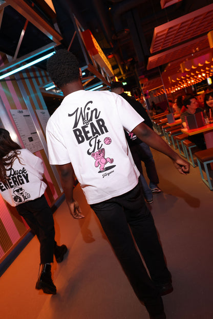 Person wearing a white t-shirt with graphic design in a casual setting